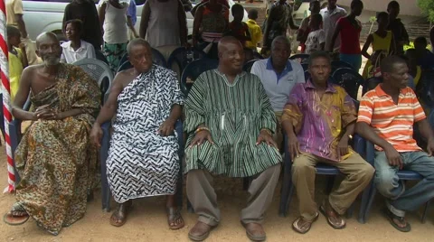 ELDERS SEATED AT SCHOOL CEREMONY WATCHING PERFORMANCE Stock Footage 59865613