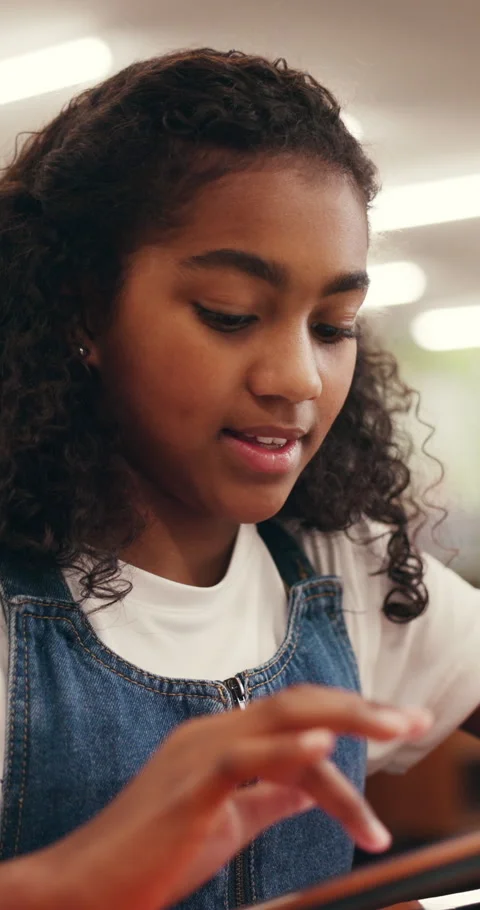 Elearning, child and scroll with tablet in library for education, distance Stock Footage 320245511