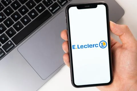 E.Leclerc mobile application on the smartphone screen. A mobile phone in a man 스톡 사진