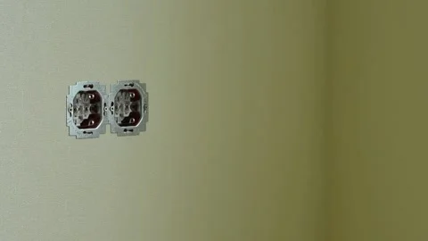 Elecrician work. Installing wall electric outlet Video stock 131396897