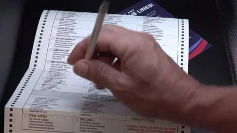 Election 2024 Voting Booth Close up early voting Trump Harris Presidential 4k Stock Footage 290455969