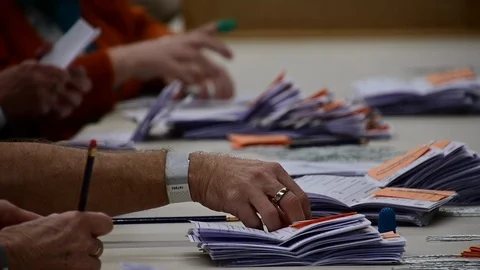 Election counters verify ballot papers Stock Footage 121478479