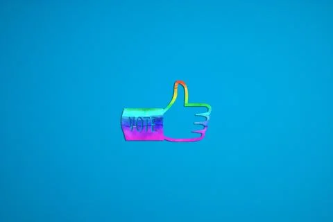 An election icon made by cutting colored paper.A blue background. Stock Illustration