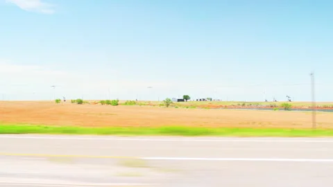 Electra Texas farm field by pumpjack pumping oil, renewable energy wind turbines Stock Footage 227192377