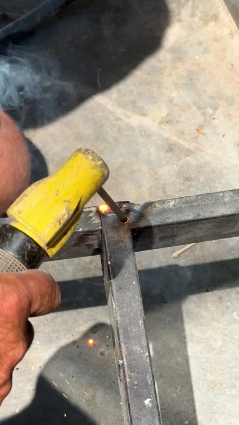 Electric arc welding process with bright sparks and smoke close up macro concept Stock Footage 343346683