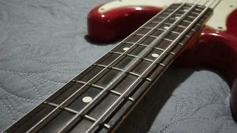Electric bass 4 strings vibration, red fender standar precision bass Stock Footage 164871445