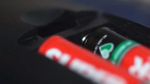 Electric Battery Or Lithium Cell Inserting Into Slot - Macro Shot Stock Footage 344767658