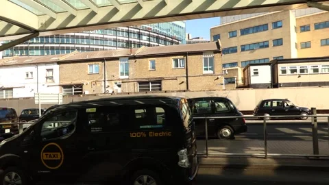 Electric black cab taxi queue at London King's Cross Station Stock Footage 318820693