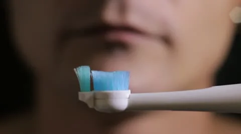Electric brushing teeth close up Stock Footage 12082886