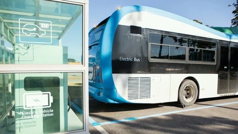 Electric bus stands at the charging station. Stock Footage