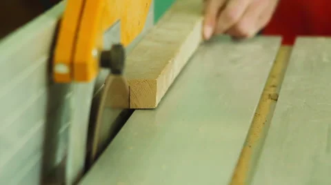 Electric buzz saw cutting some wood boards Stock Footage 64802697