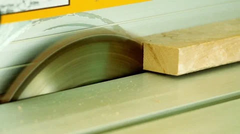 Electric buzz saw cutting some wood boards Stock Footage 64802791