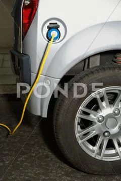 Electric Cable Attached To Electric Car