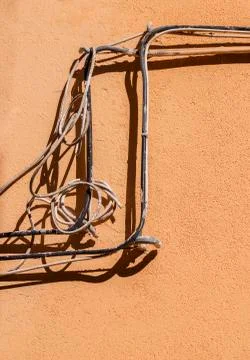 Electric cable mess on a wall Stock Photos