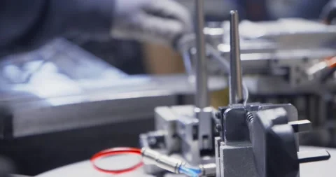 Electric cable with plug rolled in skein by industrial machinery, close up Stock Footage 154798528