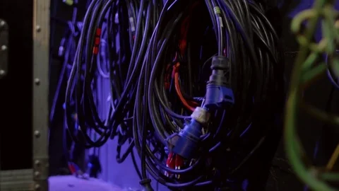 Electric cables for sound equipment are twisted hanging on the wall in the sound Stock Footage 74431184