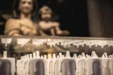 Electric candle in front of the statue of the Blessed Virgin Mary in Alcobaca Stock Photos
