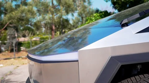 An electric car with an angular design displayed outdoors. Stock Footage 274452845