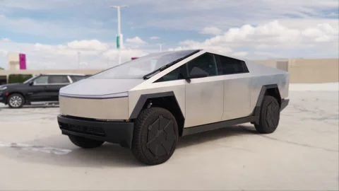 An electric car with an angular design displayed outdoors. Stock Footage 274452924