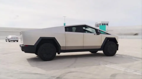 An electric car with an angular design displayed outdoors. Stock Footage 274452925