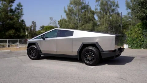 An electric car with an angular design displayed outdoors. Stock Footage 274453039