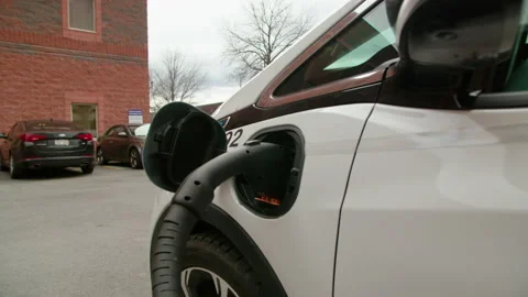 Electric Car being charged with DC Fast Charger Stock Footage 154117983