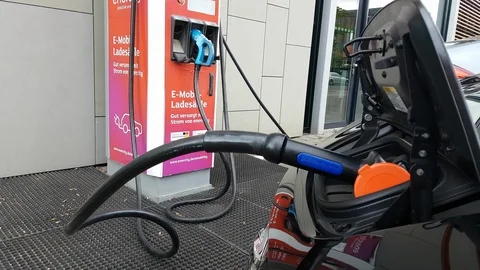 Electric Car Charging by cable Stock Footage 108774399