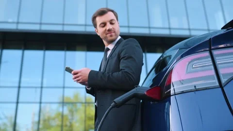 Electric car is charging Stock Footage 243641194