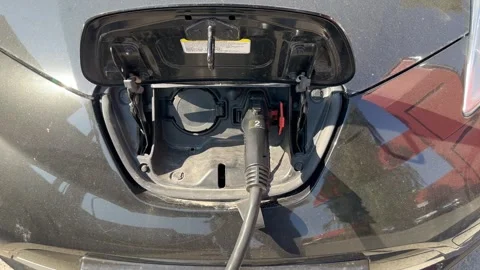 The electric car is charging Stock Footage 251999036