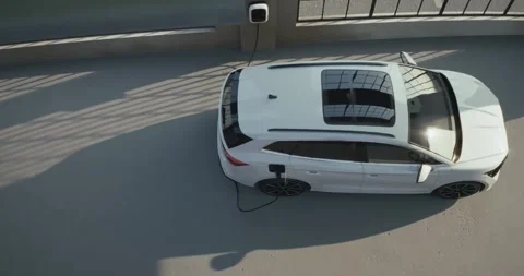 Electric car is charging inside an industrial garage Stock Footage 314091611