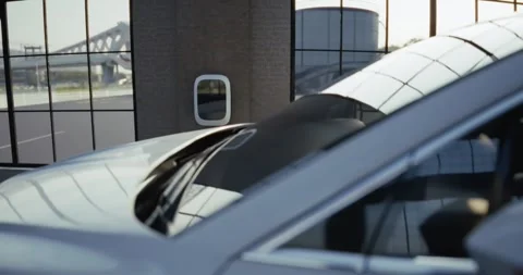 Electric car is charging inside an industrial garage Stock Footage 314322799