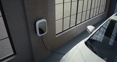 Electric car is charging inside an industrial garage Stock Footage 314322812