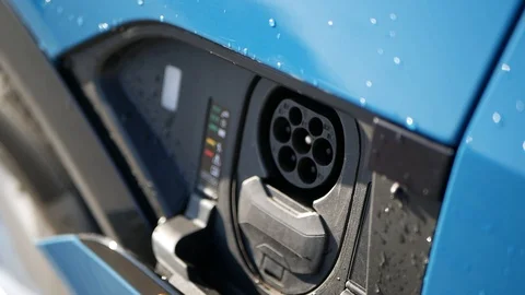 Electric car charging plug opens with finger touch Stock Footage 122496399