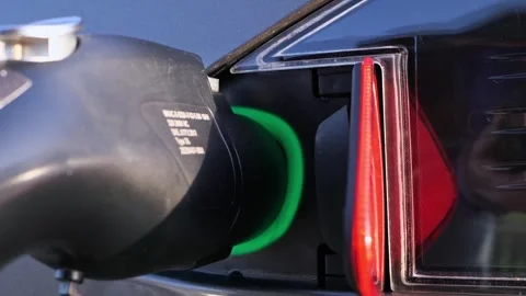 Electric car charging plug with status ring turning from blue to green Stock-Footage 346391667