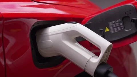 Electric car charging with a power cable connector 動画素材 337645169