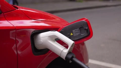Electric car charging with a power cable connector Stock-Footage 338162272