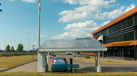 Electric car charging from solar panels zoom time-lapse Stock Footage