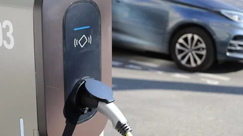 Electric car charging station plug and wire Stock Footage 171553630