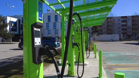 Electric Car Charging Stations in a Modern Urban Parking Lot Stock-Footage 333850722