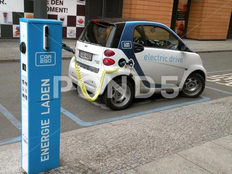 Electric Car Charging In The Street