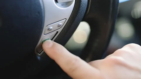 Electric car driver pressing eco button steering wheel, environmental protection Video stock 196002726