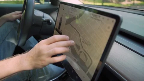 Electric car driver using navigation map Stock Footage 135725653
