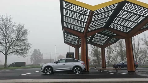 Electric car is fast charging while another electric car arrives 스톡 동영상 171581829