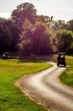 Electric car on the golf course, active leisure, quiet sport, recreation Stock Photos