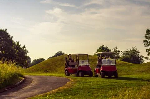 Electric car on the golf course, active leisure, quiet sport, recreation Stock Photos