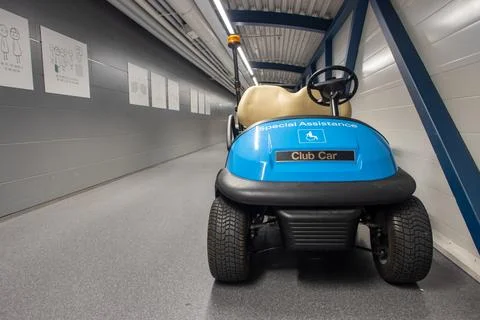 The electric car is parked in the corridor of the airport Stock Photos
