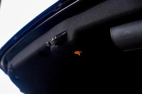 Electric car trunk lock button with trunk closing handle. Rear trunk lock. Stock Photos