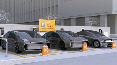 Electric cars in car sharing parking lot Stock Footage