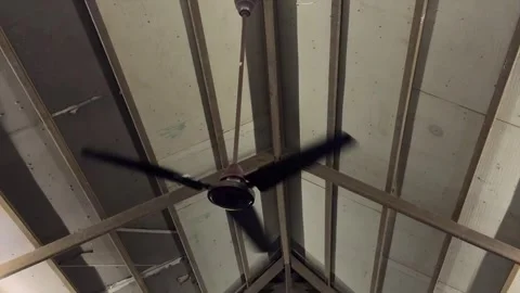 Electric Ceiling Fan Running at High Speed Inside House Roof Structure Video stock 338040632
