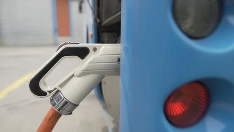 Electric charger connected to the bus, stock video Stock Footage